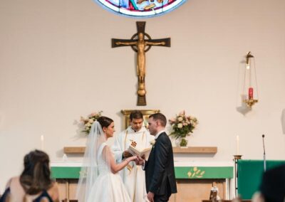 Bride and groom exchange vows at wedding in Chesham Bois, Buckinghamshire