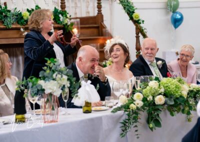 Kings Chapel wedding in September. Bride and groom laughing during speeches.