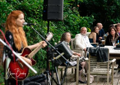 Kings Chapel wedding in September. guests relax in garden to live music.