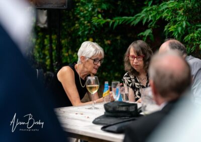Kings Chapel wedding in September. Guests chatting in garden