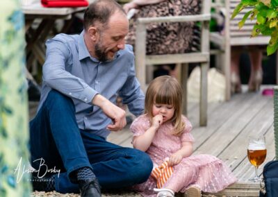 Kings Chapel wedding in September. Father and daughter in garden.