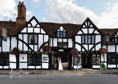Kings Chapel wedding in September. Bride and groom in entrance to the Kings Arms hotel.
