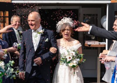 Kings Chapel wedding in September. Bride and groom confetti tunnel.