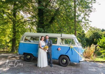 Magnolia Park wedding. Bride and groom with blue camper van