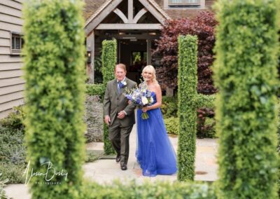 Older Couple wedding photographs. Bride with father. Blue wedding dress.