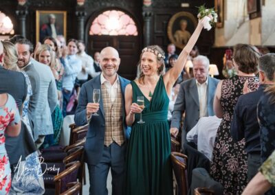 Older Couple wedding photos. Bride and groom enter wedding breakfast.