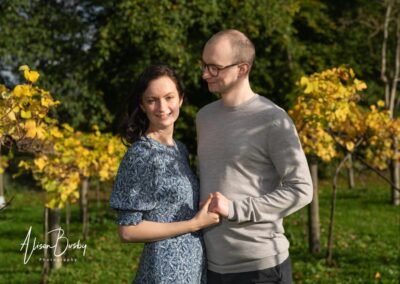 Oxford engagement shoot. couple in vineyard of Old Luxters Barn in Oxfordshire.