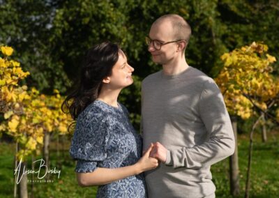 Oxford engagement shoot. couple in vineyard of Old Luxters Barn in Oxfordshire.