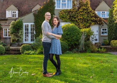 Oxford engagement shoot. couple in gardens of Old Luxters Barn in Oxfordshire.