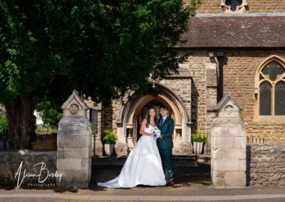 Bride and groom at Our Lady and St Edmunds Church in Abingdon, Oxfordshire.