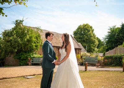 Oxfordshire tipi wedding at Dovecote Events. Bride and groom near to Dovecote Barn.