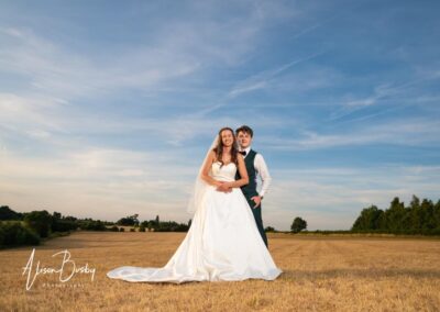 Oxfordshire tipi wedding at Dovecote Events. Bride and groom at sunset.