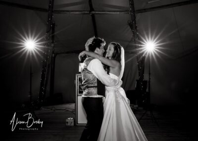 Oxfordshire tipi wedding at Dovecote Events. Bride and groom first dance.