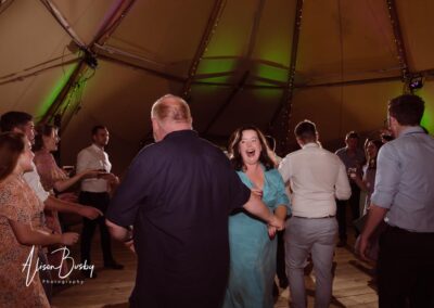 Oxfordshire tipi wedding at Dovecote Events. Guests dancing