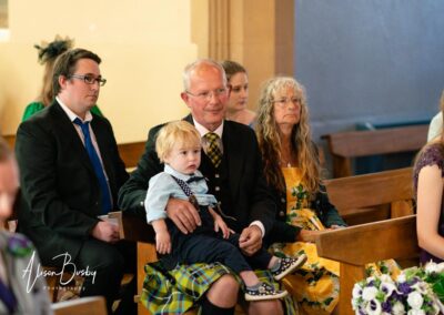 Wedding guests at Our Lady and St Edmunds Church in Abingdon, Oxfordshire.