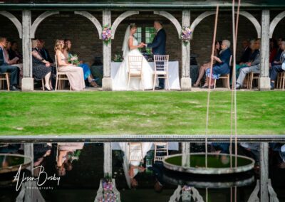 Unplugged ceremony. Bride and groom with restricted photography coverage.