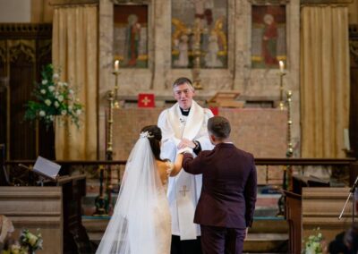 Unplugged ceremony. Bride and groom with restricted photography coverage.