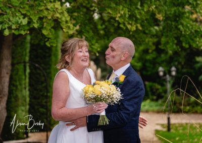 Wedding photography for older couples. Bride and groom laughing during portrait session.