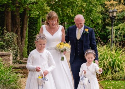 Wedding photography for older couples. Bride and groom with grandchildren.