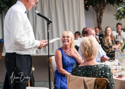 Wedding photography for older couples. Bride laughing at groom's speech