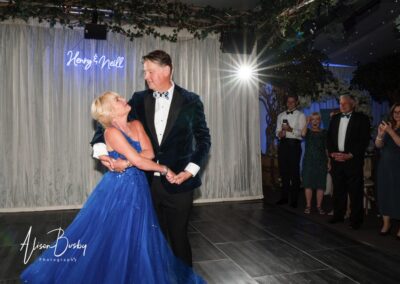 Wedding photography for older couples. Bride and groom first dance. Blue wedding dress.