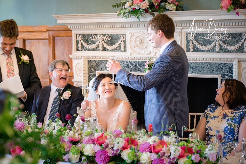 Graduate wedding photography offers. Groom speech at Eynsham Hall in Oxfordshire.