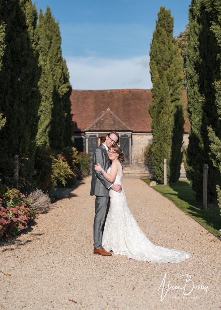 Notley Tythe Barn wedding. Bride and groom outside Notley Tythe Barn in Buckinghamshire