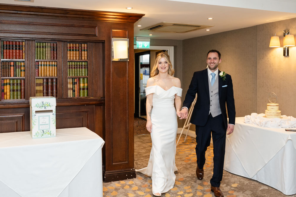 Bride and groom arriving for wedding breakfast at the Bull Hotel in Gerrards Cross