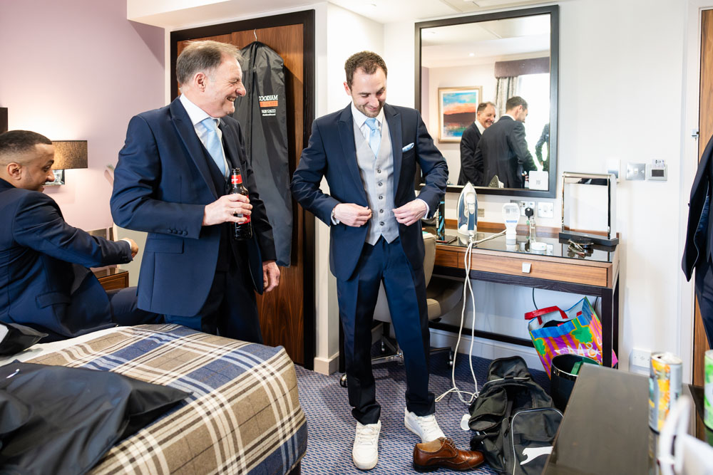 Groomsmen hide groom's shoes at the Bull Hotel in Gerrards Cross