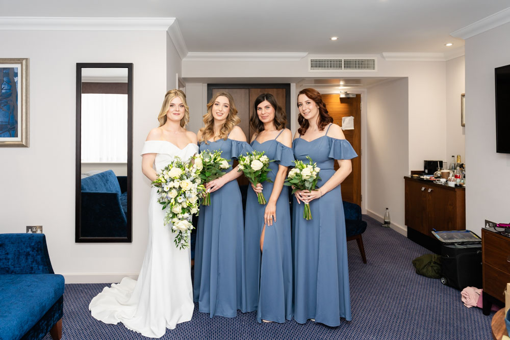 Bride and bridesmaids before ceremony at the Bull Hotel in Gerrards Cross