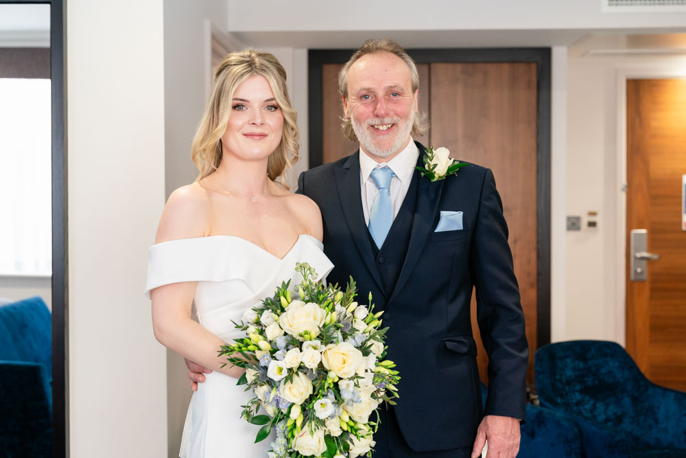 Beautiful bride with her father at the Bull Hotel in Gerrards Cross