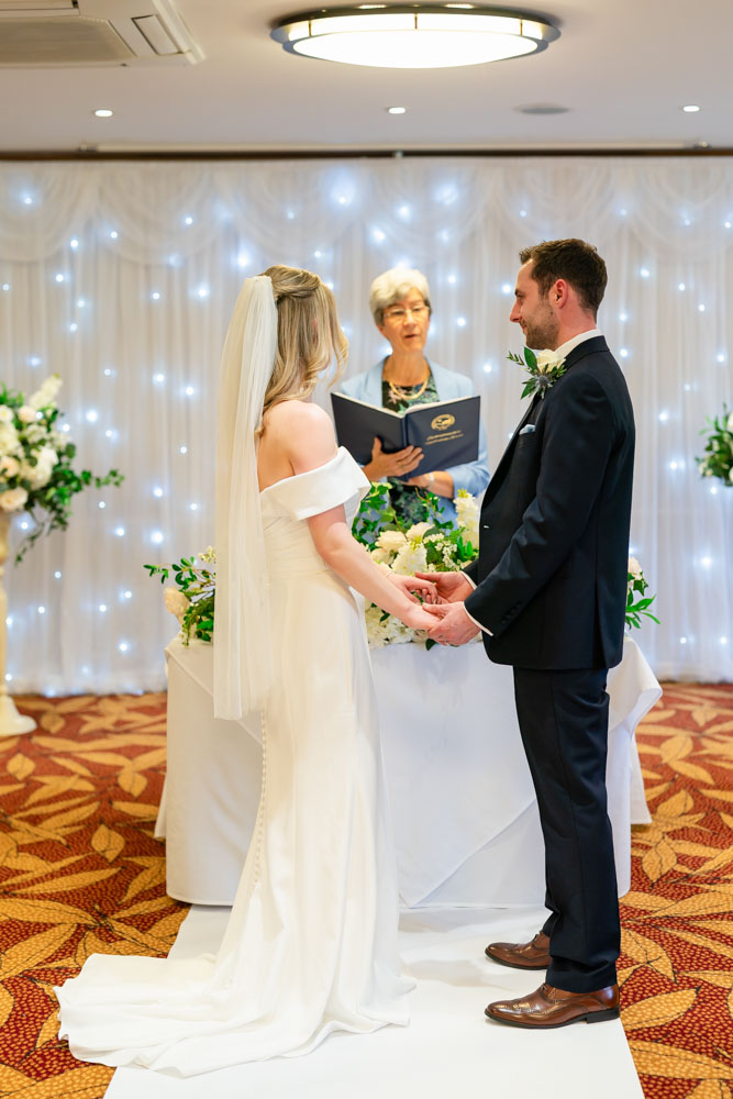 Bride and groom exchange vows at the Bull Hotel in Gerrards Cross