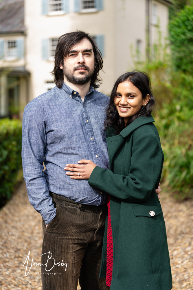 Amersham engagement photos. Young couple on drive of stunning home in Buckinghamshire garden
