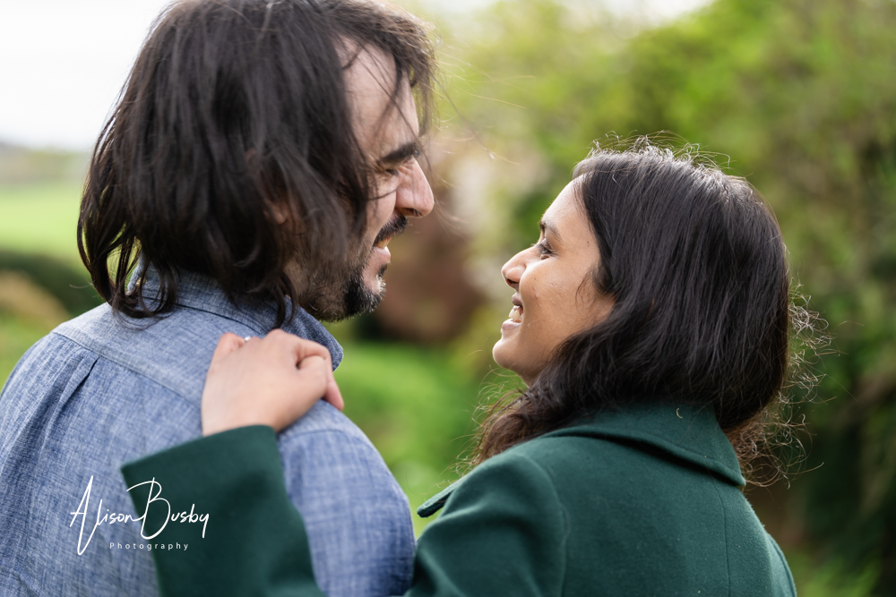 Amersham engagement photos. Young couple laughing together at April shoot in Buckinghamshire.