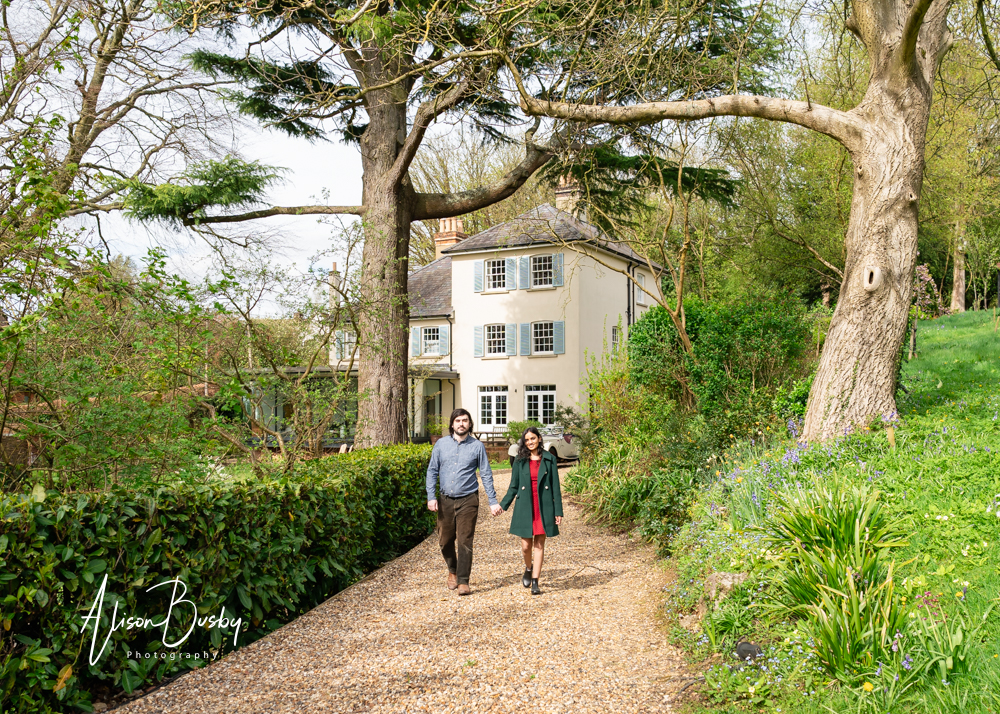 Amersham engagement photos. Young couple walking in Buckinghamshire garden