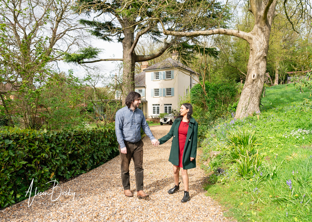 Amersham engagement photos. Young couple laughing in Buckinghamshire garden
