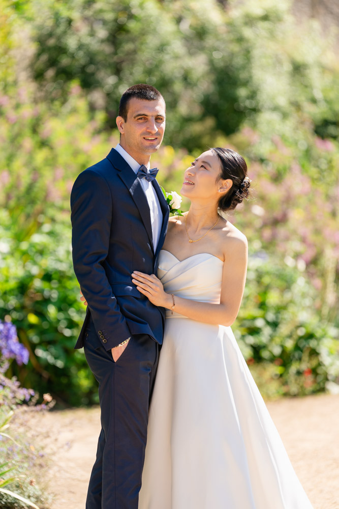 Bride and groom in garden of New College Oxford