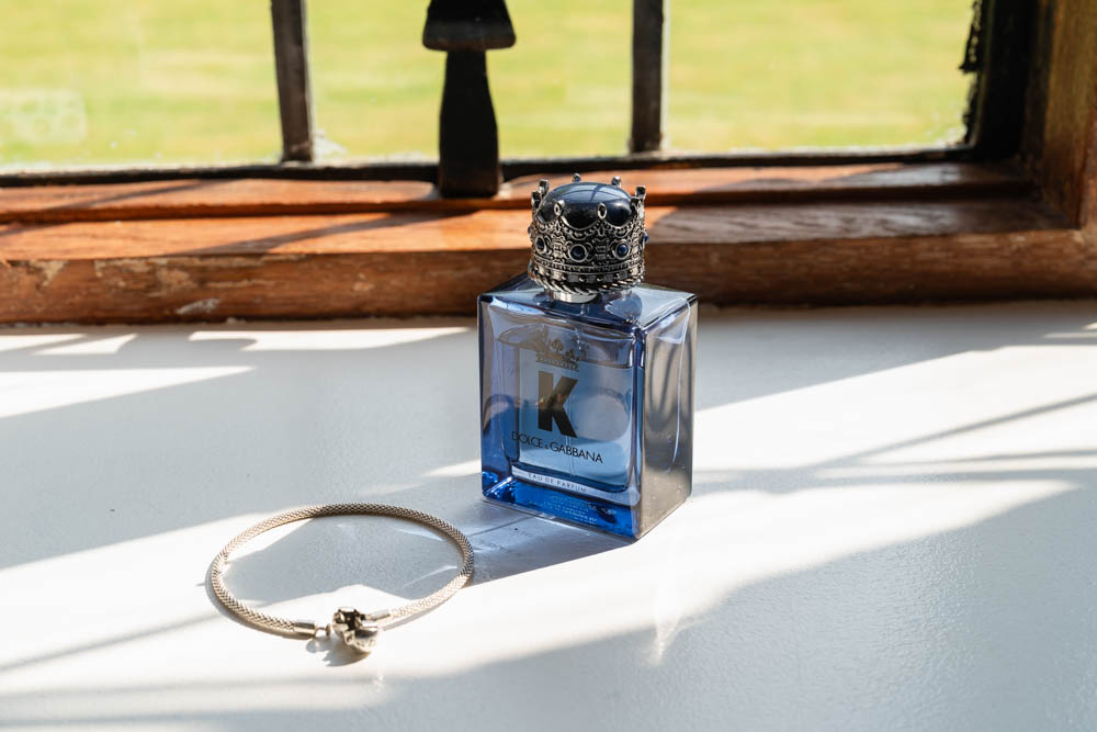 Notley Abbey groom prep. Photo of groom' cologne and jewellery