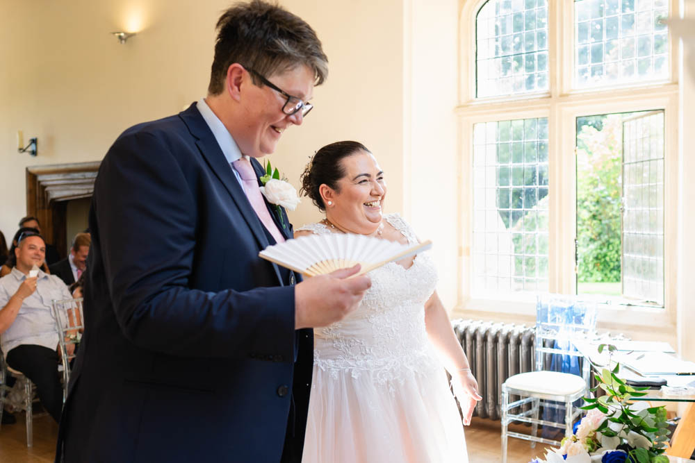 Notley Abbey wedding photographer. Bride and groom during ceremony in Abbot's Hall