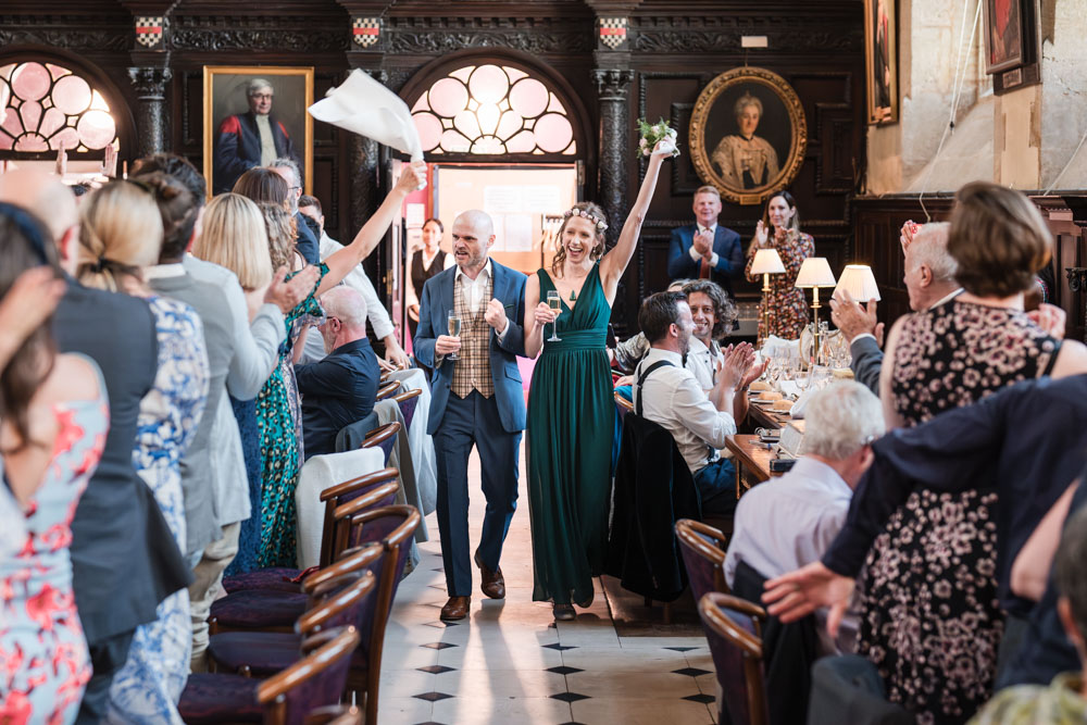 Bride and groom entrance to wedding breakfast at Exeter College wedding