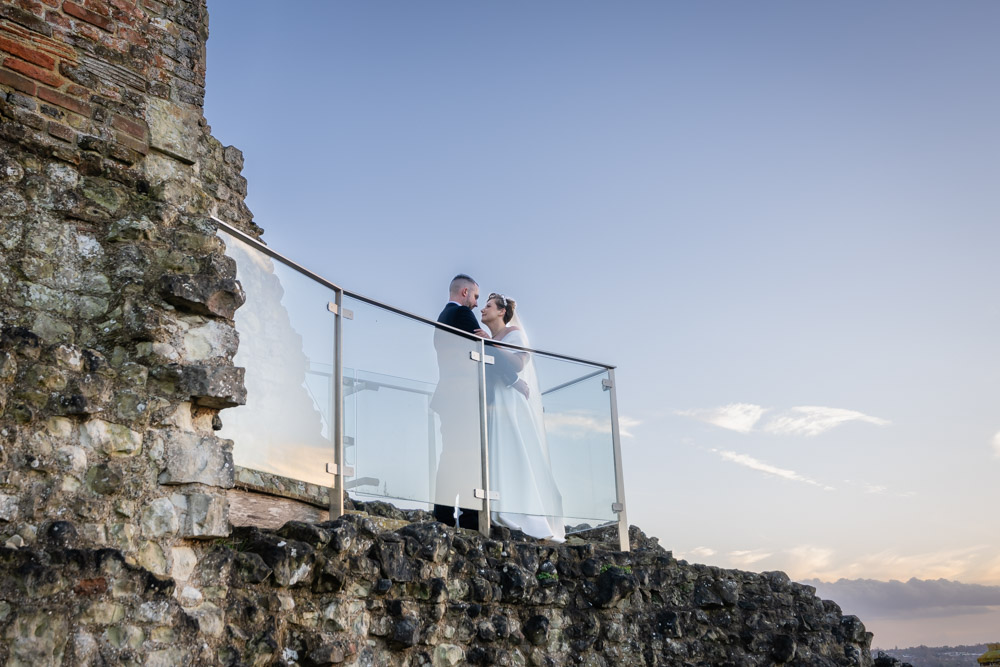 Farnham castle wedding photographer. Bride and groom on viewing platform of Keep.