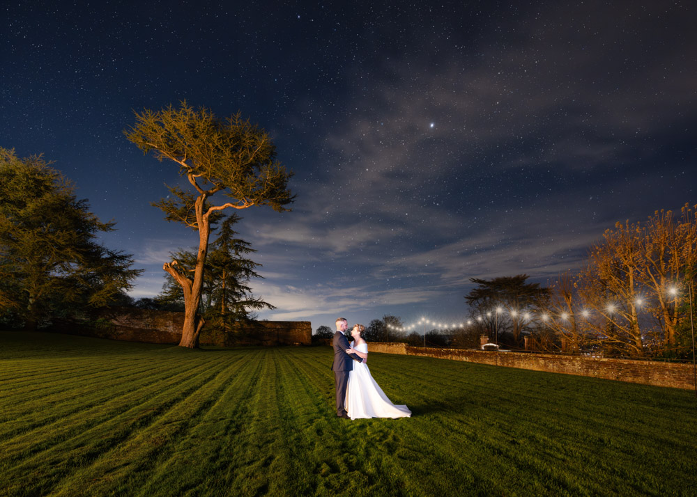 Bride and groom astro wedding portrait by Farnham Castle wedding photographer.