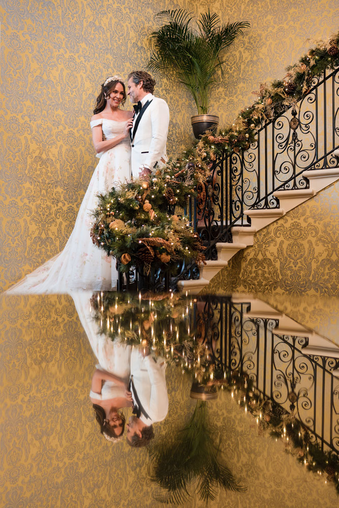 Hedsor house wedding photography. bride and groom on staircase