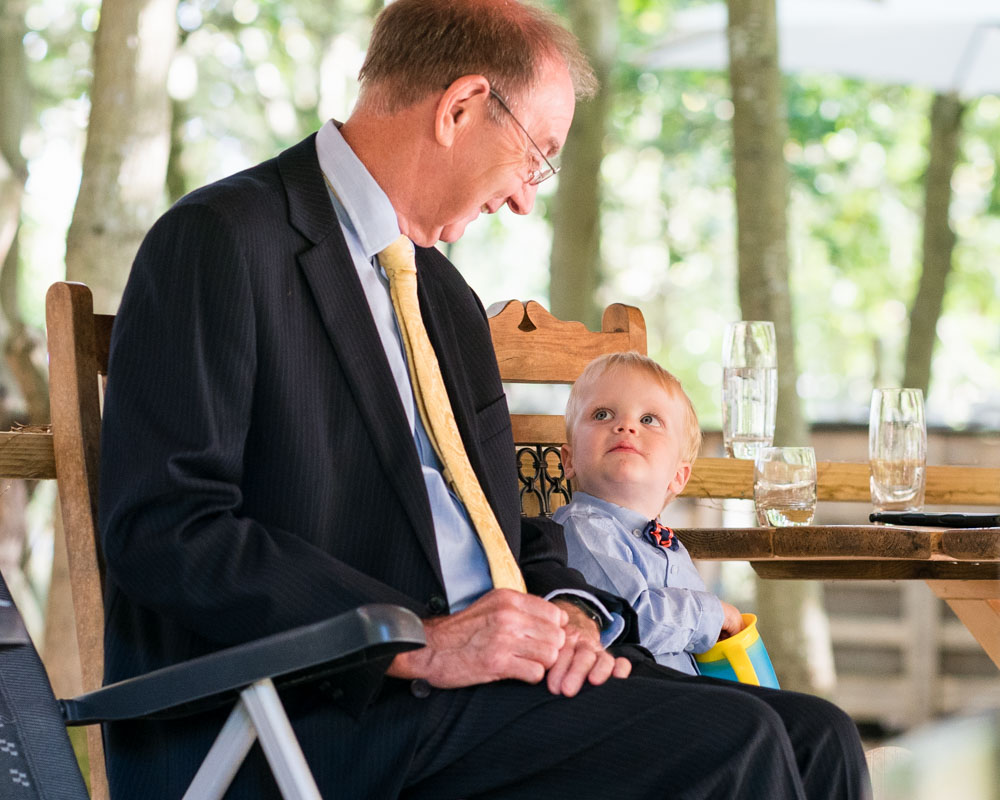 Wedding photography buckinghamshire. father of the bride and nephew discuss weddings