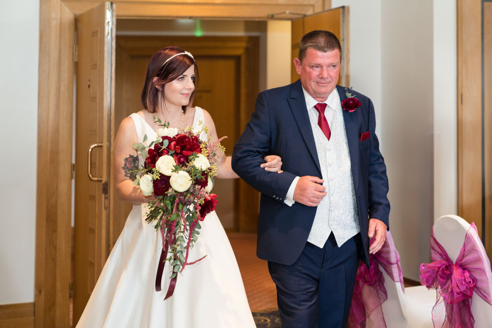 Wedding photography Oxfordshire. Bride and father arriving for ceremony at Oxfordshire Hotel and Spa
