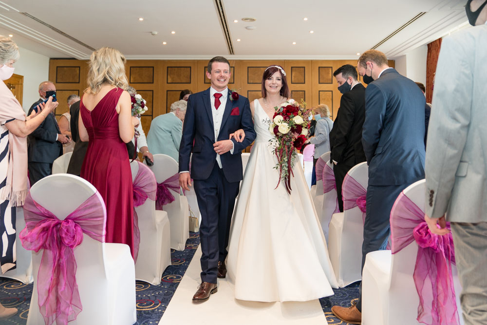 Wedding photography Oxfordshire. Bride and groom leaving ceremony at Oxfordshire Hotel and Spa