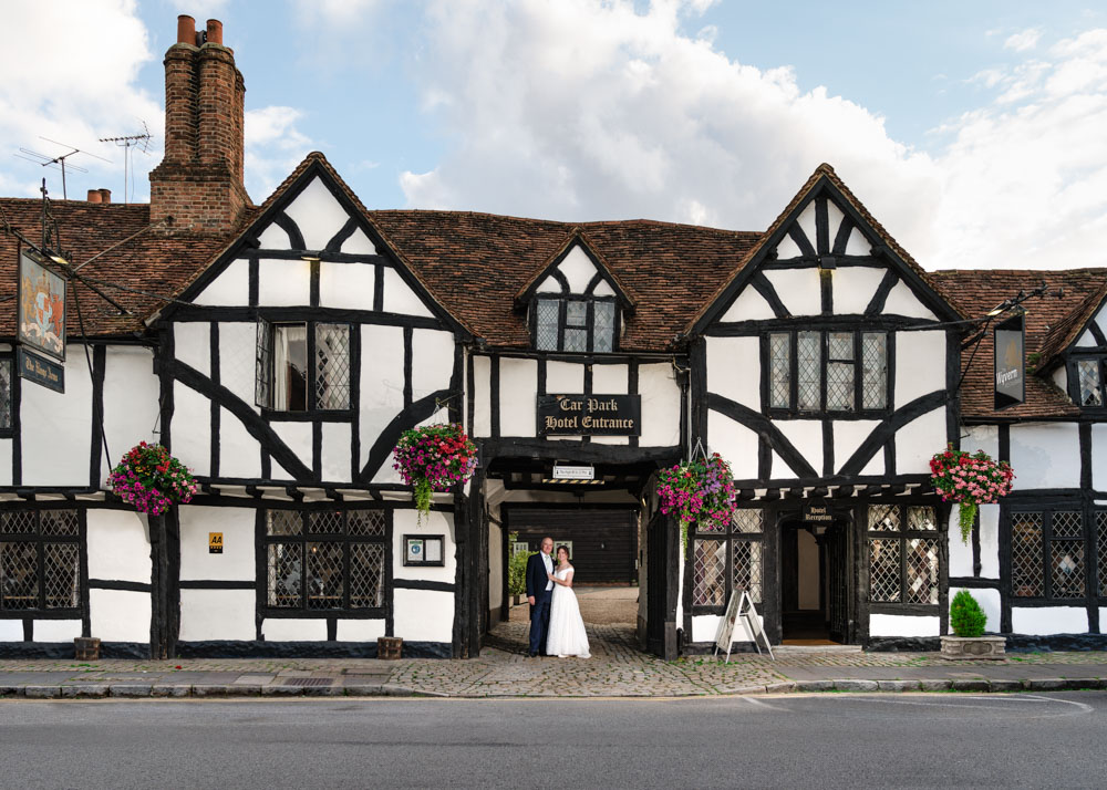 Wedding photos Kings Chapel Amersham. Bride and groom in entrance to Kings Arms hotel.