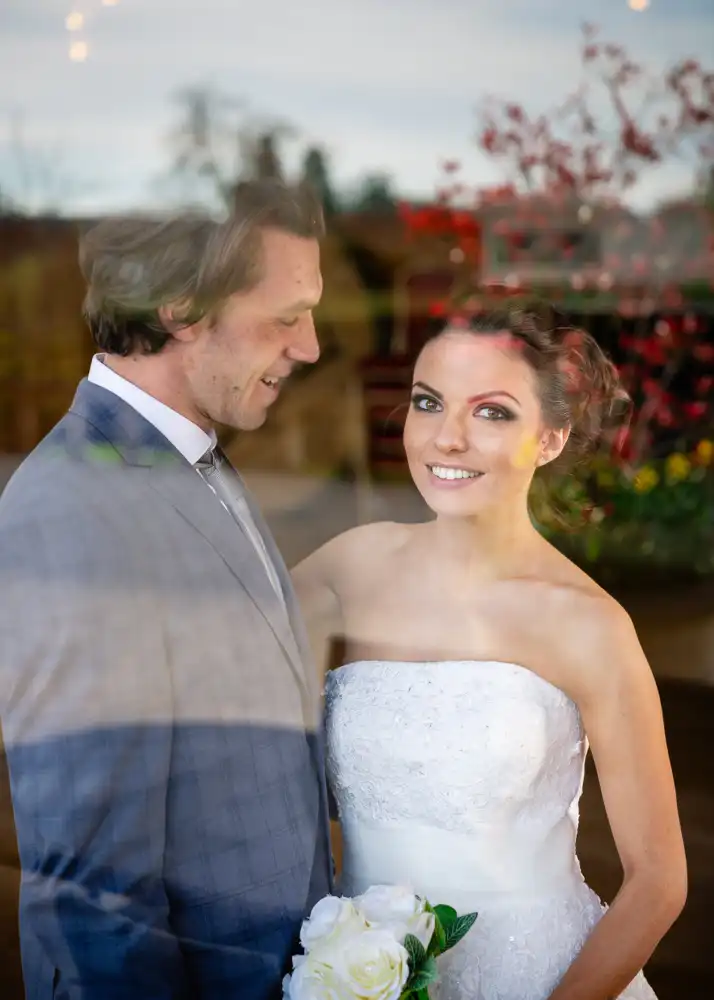 Bride and groom with window reflection taken by Buckinghamshire wedding photographer Alison Busby