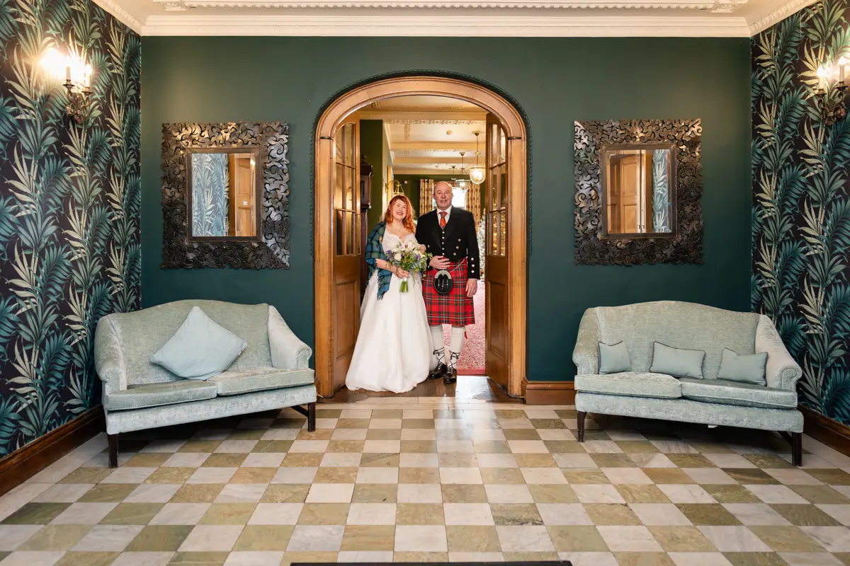 Bride and father leaving Milton Hill House for Garden house venue wedding.
