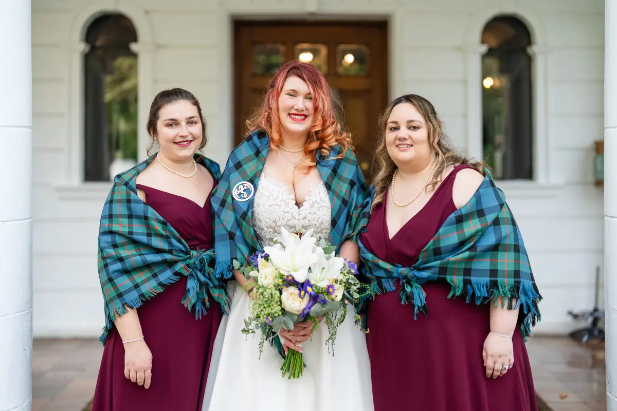 Bride and bridesmaids outside Milton Hill House before leaving for Garden house venue wedding.